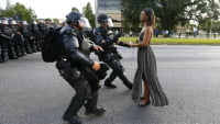 Young black woman about to get arrested